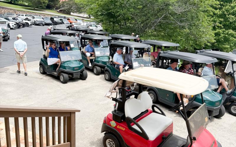 Golfers lined up to take off.