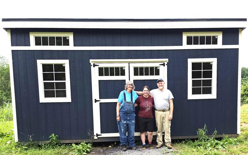 Kathy, Amy and Keith Gibby stand in front of doors which will open  to Still Waters Landing Produce Market in late summer or early fall this year.