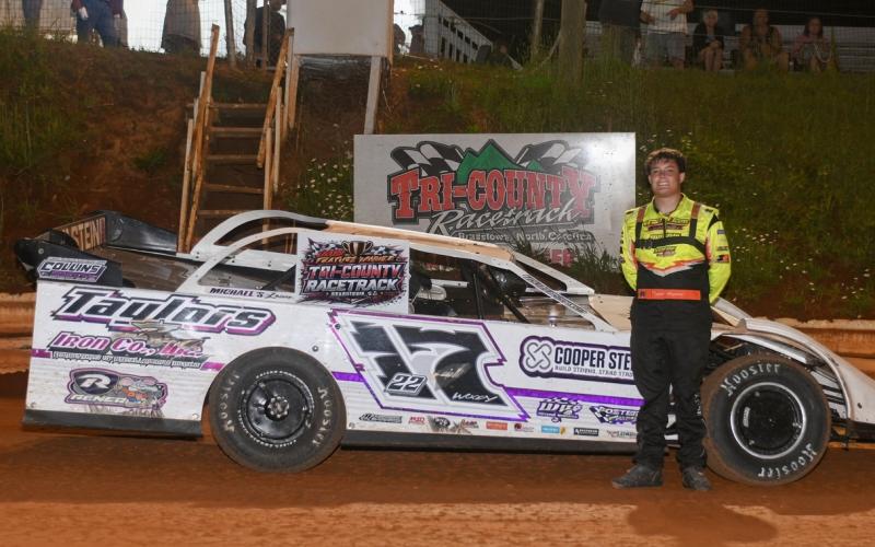 Tucker Anderson is all smiles in victory lane following his main event win.