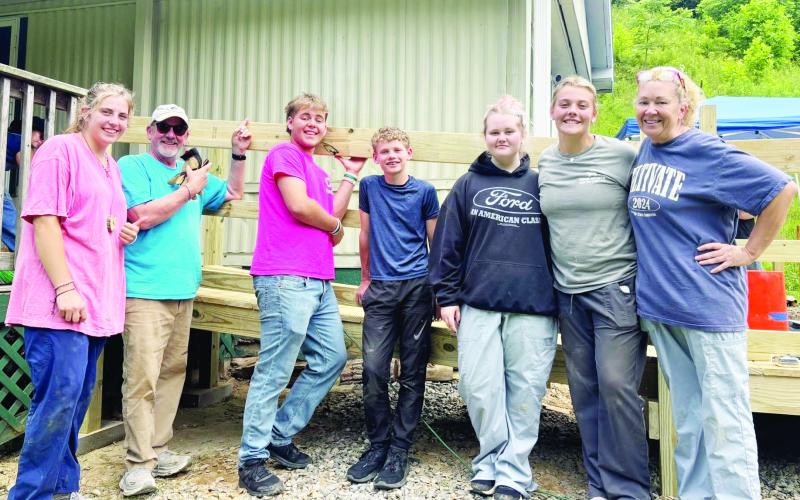 Maggie McClure, Kirk Hatherly, Ethan Koenig, Eli Danico, Polly Jones, Lillie McClure and Kelly Jones are all smiles after building a ramp for a homeowner in need.