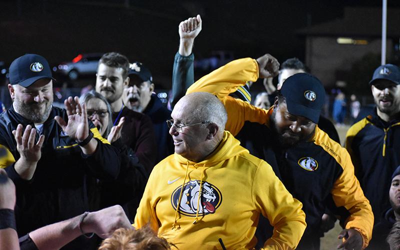 Coach David Gentry celebrates with coaches and fans after winnings his 413th game at Swain County on Friday night.