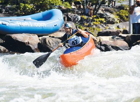 Shawn Malone heads down the Ocoee River across the state line in Tennessee on a test run of the slalom course for the second annual Ocoee River Championships on Friday morning.