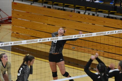 Jade Patterson awaits a floating ball so she can swat it to the floor for a kill.    Travis Dockery • Clay County Progress