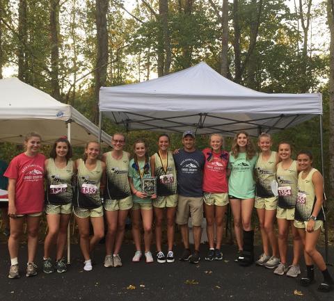 Colleen Urbaniuk • Submitted  //  The Lady Yellow Jackets celebrate the Carney Classic victory. From left, Allison Thomas, Meg Barton, Samantha Moral, Leah Hatherly, Caroline Burch, Kayson Krieger, coach Zach Moss, Cecilia Jones, Elizabeth Beck, Serina Penland, Lila Roberts and Meadow Rose.