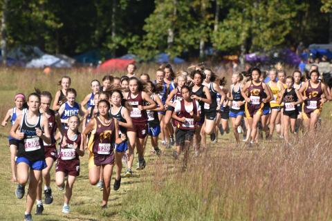 Travis Dockery • Clay County Progress //  A field of 70 runners launch for the start of the middle school girls’ portion of the Carney Classic held at Chatuge Dam.