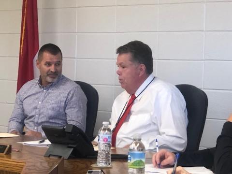 (Lorrie Ross • Clay County Progress) The October meeting of the Clay County Board of Education should be Scotty Penlands’ last meeting as Acting School Superintendent since Dale Cole will begin Friday, Nov. 1. At the October 17 meeting, Board of Education Chairman Dr. Jason Shook, left, laughs as Penland describes serving food in the school cafeteria earlier in the week.