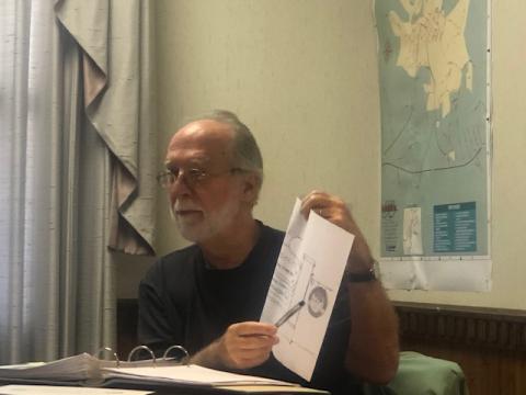 (Lorrie Ross • Clay County Progress) Hayesville Town Councilman Joe Slaton shows a drawing of proposed changes to the Town of Hayesville signs.