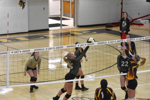 (Travis Dockery • Clay County Progress) Sydney Patterson barely skims the net with a push against Cherokee. Hayesville won the match 2-0.