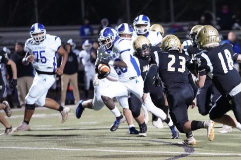 (Kelli Graves • Clay County Progress) Hayesville’s defense struggles to contain Albemarle’s Julius Smith during Friday’s playoff game.