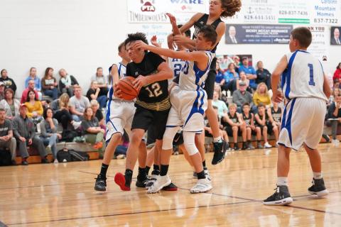 (Kelli Graves  • Clay County Progress) Things get physical as Seth Leek tries to create space Thursday.