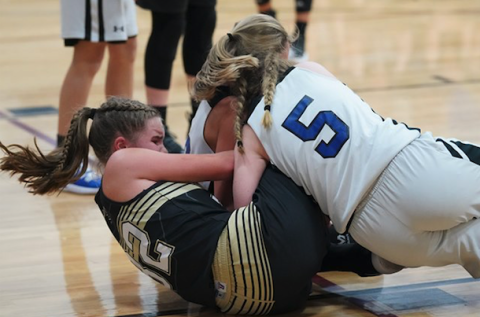 (Kelli Graves • Clay County Progress) Mallory Peck fights for the ball as the Lady Jackets fight for a win.