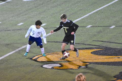 (Travis Dockery • Clay County) Progress Lee Anderson tries to protect the ball and advance toward the goal against Queen’s Grant.