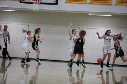 Photo by Kelli Graves / Clay County Progress: Lady Jackets pair off with Robbinsville while orchestrating a rally.