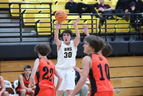 (Kelli Graves • Clay County Progress) Peyton Hunt lets a shot fly in his 16-point game against Rosman.