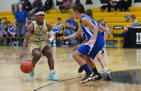 (Kelli Graves • Clay County Progress) Asher Brown uses smooth ball-handling skills to keep possesion.