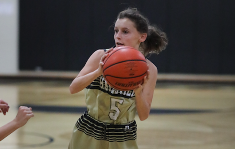 (Kelli Graves • Clay County Progress) Emma Ashe looks for an open lane in front of the home crowd.