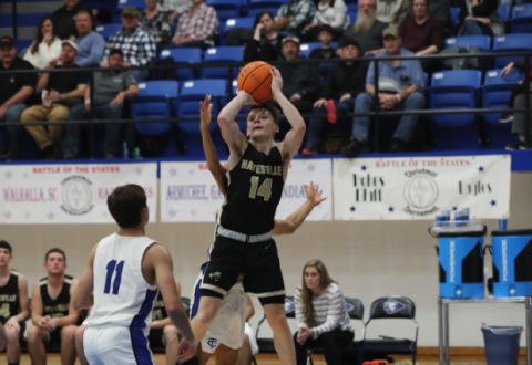 (Kelli Graves / Clay County Progress) Sophomore point guard Kolbe Ashe goes airborne for 2 points in the semifinal round. 