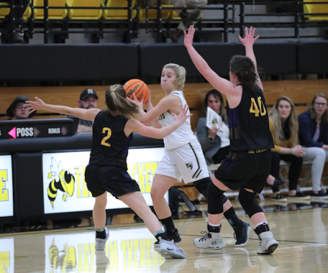 (Kelli Graves • Clay County Progress) Annie Brooks looks for an open passing lane against Highlands. 