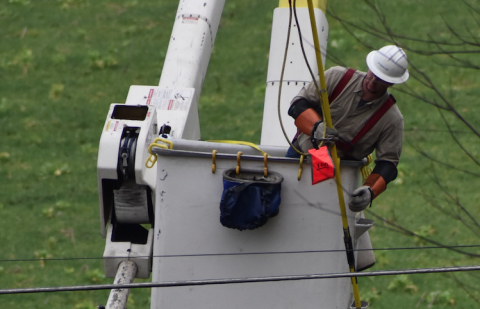 (Becky Long • Clay County Progress) A lineman from Jackson EMC in Jefferson, Ga. works on an outage on Piney Rd. Monday morning.