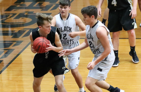 Seth Hedden finds himself in a double team situation against Robbinsville.