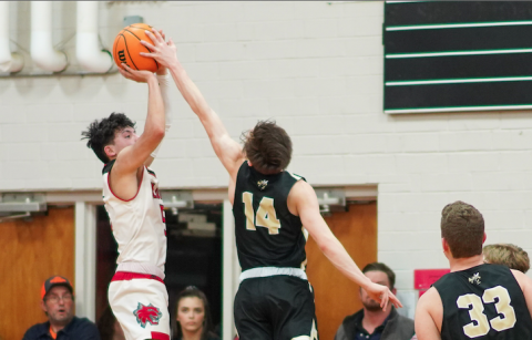 (Kelli Graves• Clay County Progress) Sophomore Kolbe Ashe reaches out just in time to stop a Wildcat shooter during Monday night’s game.
