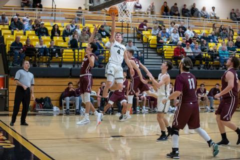 (Kelli Graves • Clay County Progress) Hayesville’s Hayden McClure takes to the air for the score. McClure caused trouble for Swain on both ends of the court. 