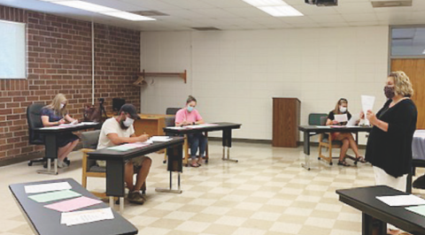 Pre-Kindergarten Director Lisa Chambers discusses the upcoming school year during a meet the teacher event Wednesday morning. The school year will look much different as Clay County and the state function under reopening guidelines. Clay County Schools will be open for business Aug. 17 and there are still technicalities to work out. Parents will be receiving a survey in the next week or so. 