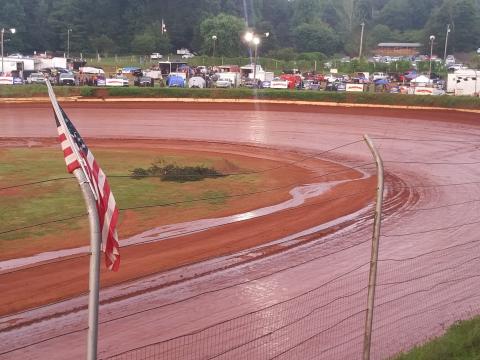 Travis Dockery • Clay County Progress A stream runs off the high banks and into the infield after a passing shower soaked the Brasstown Bullring.