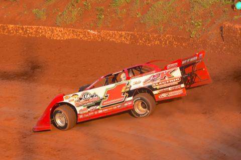 (Travis Dockery • Clay County Progress) Eventual Super Late Model winner Kenny Collins hits the high line during practice laps at Tri County Racetrack. 
