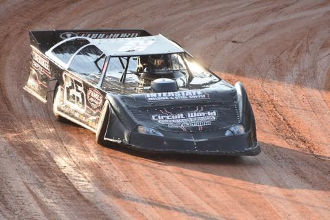 Travis Dockery • Clay County Progress Modified Hobby feature winner Jacob Hamby exits turn four and powers down the front stretch.