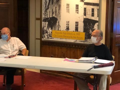 (Lorrie Ross• Clay County Progress) Mayor Harry Baughn, left, and Hayesville Town Council Chairman Joe Slaton sit several feet apart to maintain social distancing