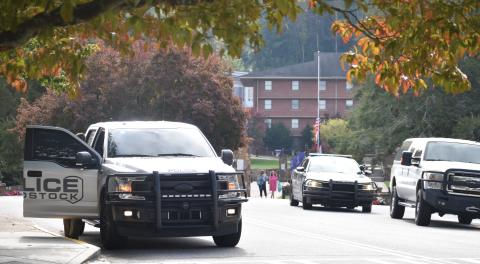 (Becky Long • Clay County Progress) Towns County Sheriff’s officers and other law enforcement agencies block entrances to Young Harris College Monday afternoon.