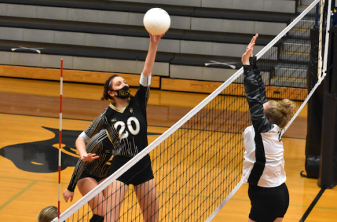 (Kevin Hensley • Graham Star) High flying Hallie Johnson soars in an attempt to keep a volley alive. 