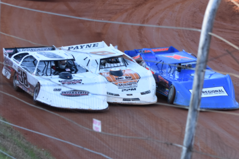 Travis Dockery • Clay County Progress Jamie Oliver, left, David Payne, middle and Shawn Chastain put the maximum amount of sheet metal in a limited space in Saturday afternoon’s Super Late Model main event.