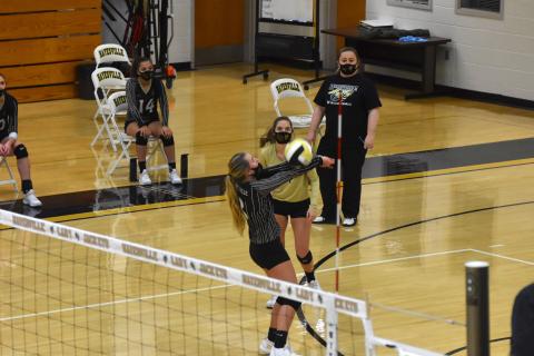 Travis Dockery • Clay County Progress Head coach Tammy Dills and Lady Jacket Madison Crawford look on as Emma Shook executes a no-look hit to keep the volley going.