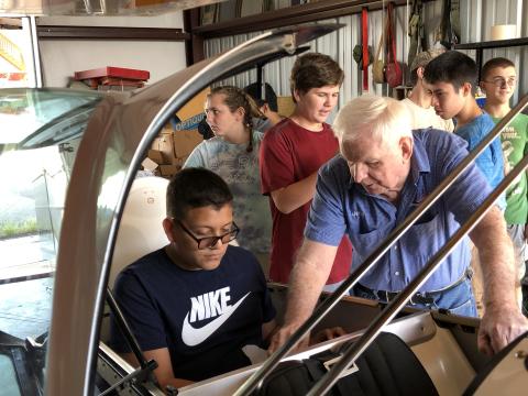 Jerry Stadtmiller gives a lesson in structure and mechanics to the aviation science class from Tri-County Early College High School.