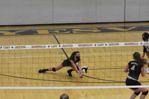 (Travis Dockery • Clay County Progress) Ava Shook hits the floor just in time to get under a potential point for Rosman.