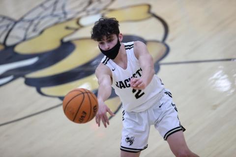 (Kelli Graves • Clay County Progress Senior) Logan Caldwell shoots a pass through a small window in Hayesville's game against Mountain Island Charter.