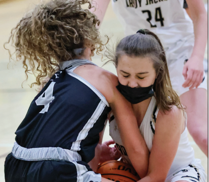 (Kelli Graves • Clay County Progress)Lila Roberts locks onto a lose ball, causing a jump ball against Robbinsville. 