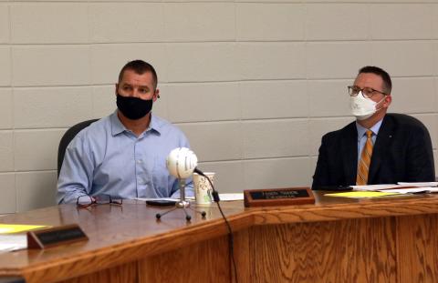 (Jared Putnam • Clay County Progress) From left, Dr. Jason Shook and Superintendent Dale Cole  look on during a called meeting of the Clay County Board  of Education on Monday. The board approved in-person  learning four days per week for middle school and high  school students.