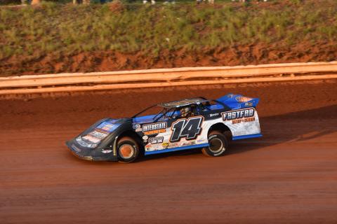 (Travis Dockery • Clay County Progress) Sylvan Schuette battles the track and the setting sun during a practice session. Schuette’s fifth place finish was the best for Tri County regulars in the Crate feature.