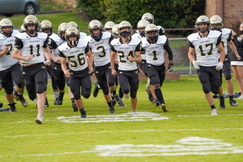 (Kelli Graves • Clay County Progress) The Yellow Jackets take the field for the final time to end the special spring season.