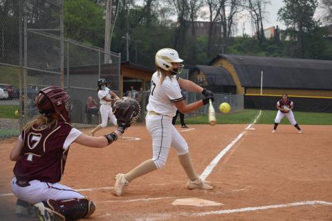 (Travis Dockery • Clay County Progress) Gracelynn Anderson sees a pitch she likes and pulls the trigger against Swain County.