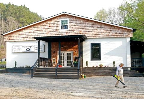 Jared Putnam • Clay County Progress West Tubing Company manager Donna Freisen does maintenance around the property on Tuesday in Warne. The business is located in the building that once housed the Tellico Lace plant.