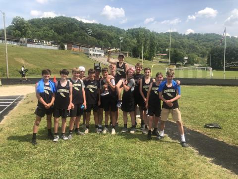 (Submitted • Brett Graves) The HMS Yellow Jackets celebrate their Smoky Mountain Conference championship. From left, Micheal Mauney, Cannon Brewer, Eli Chandler, Kendall Boyer, Chance Hughes, Kyle Shaheen, Tate Roberts, Johan Webb, Parker Hughes, Kenyon Rogers, Landon Trout, Tyler Fuller, Nick Wilson and Daniel Allen.