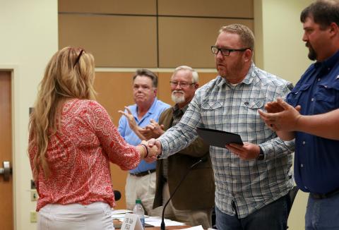 Jared Putnam • Clay County Progress Clay County Commissioners Scotty Penland, Clay Logan, Rob Peck and Randy Nichols look on as Stacie Ledford, president of Rock Bottom Recovery, receives the 2021 Governor’s Volunteer Service Award for Clay County during the board of commissioners meeting on May 6 in Hayesville.