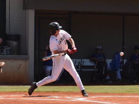(Travis Dockery • Clay County Progress) Peyton Hunt takes a pitch to the opposite field for a base hit.