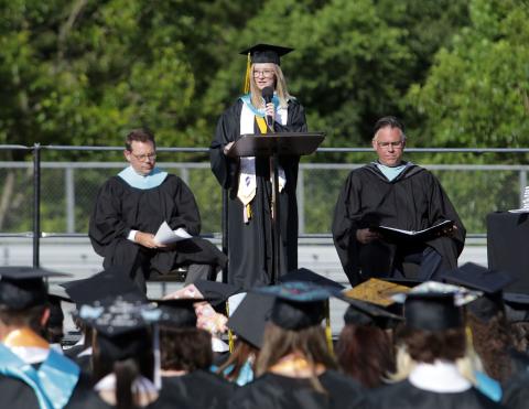 Honor graduate speaker Reagan Bunch addresses her classmates during graduation on Friday, June 4 at Hayesville High School.