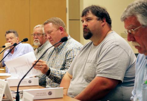 Jared Putnam • Clay County Progress From left, Clay County commissioners Scotty Penland, Clay Logan, Rob Peck, Randy Nichols and Dwight Penland listen as County Manager Debbie Mauney discusses the 2021-22 Clay County budget proposal on June 17 in Hayesville. The board of commissioners unanimously approved the $19.8 million budget.