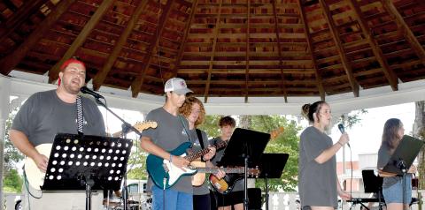 Members of the Bethel Baptist Praise Band fill the square with music and song with a special message.